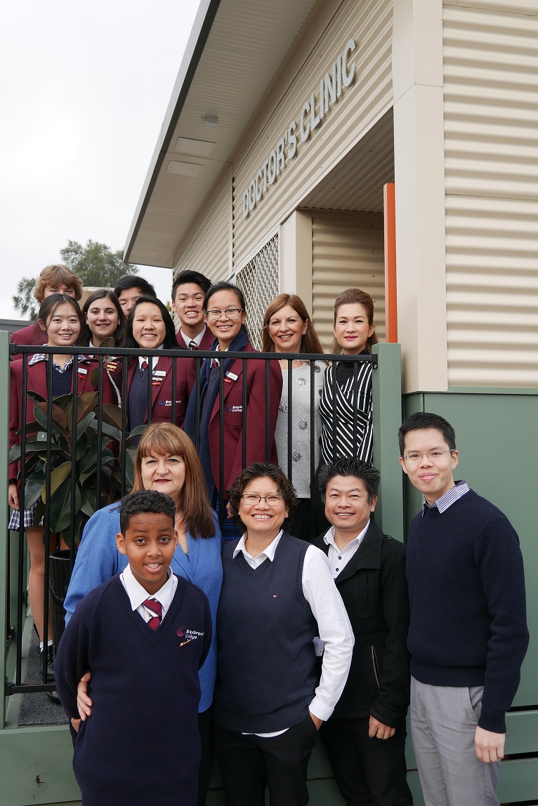 Braybrook Secondary College Principal Kelly Panousieris (front, second from left) and Dr David Nguyen (front, far right) at the launch of the Doctors in Secondary Schools clinic. DISS Braybrook small size