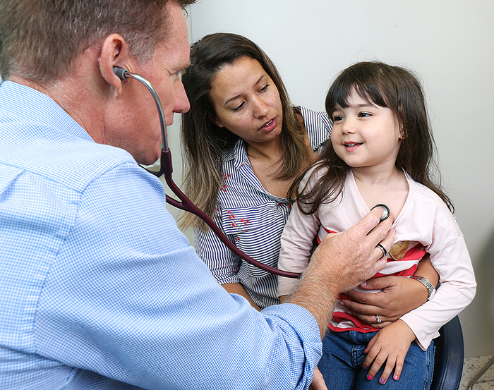 Mother and child with doctor