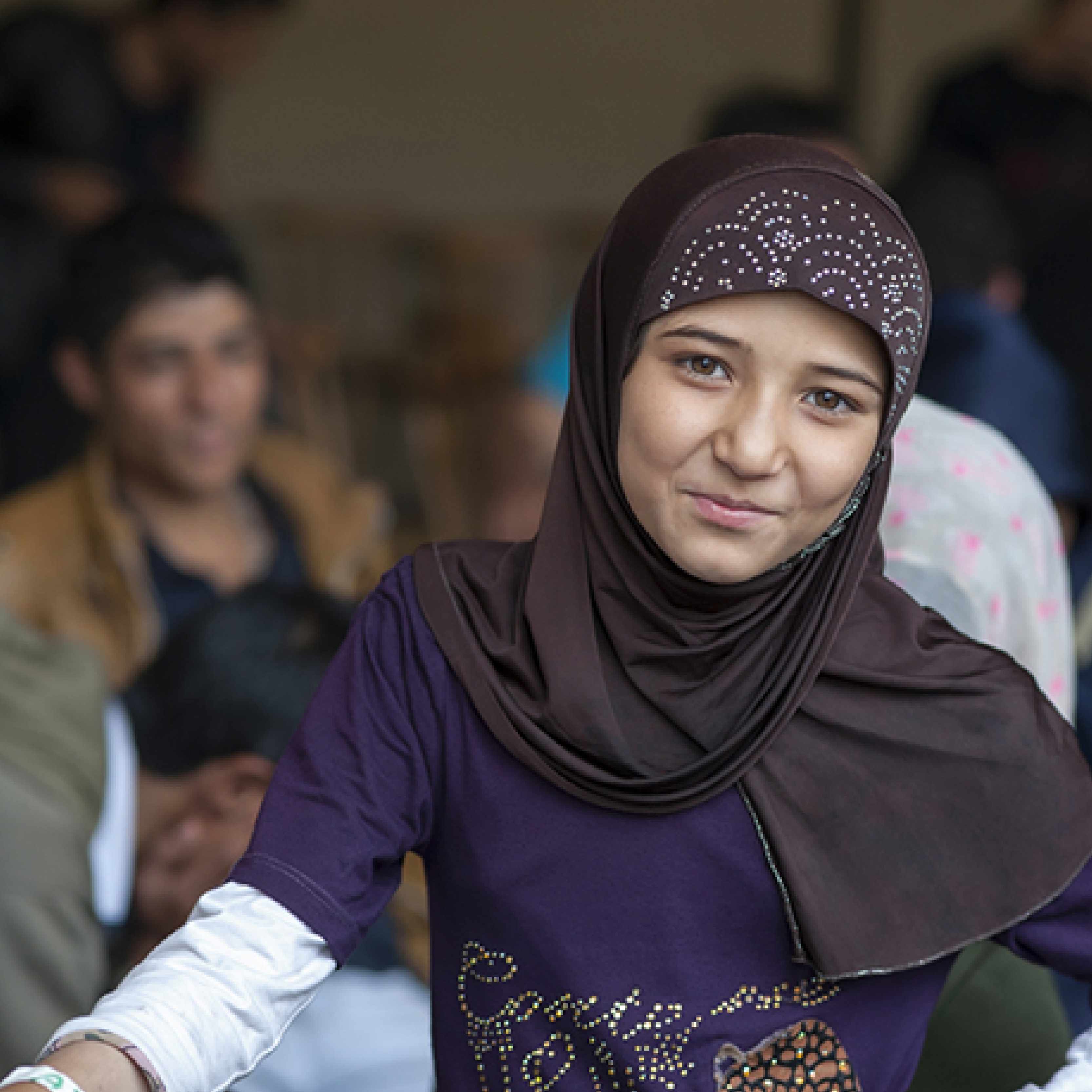 Syrian refugee smiling to camera