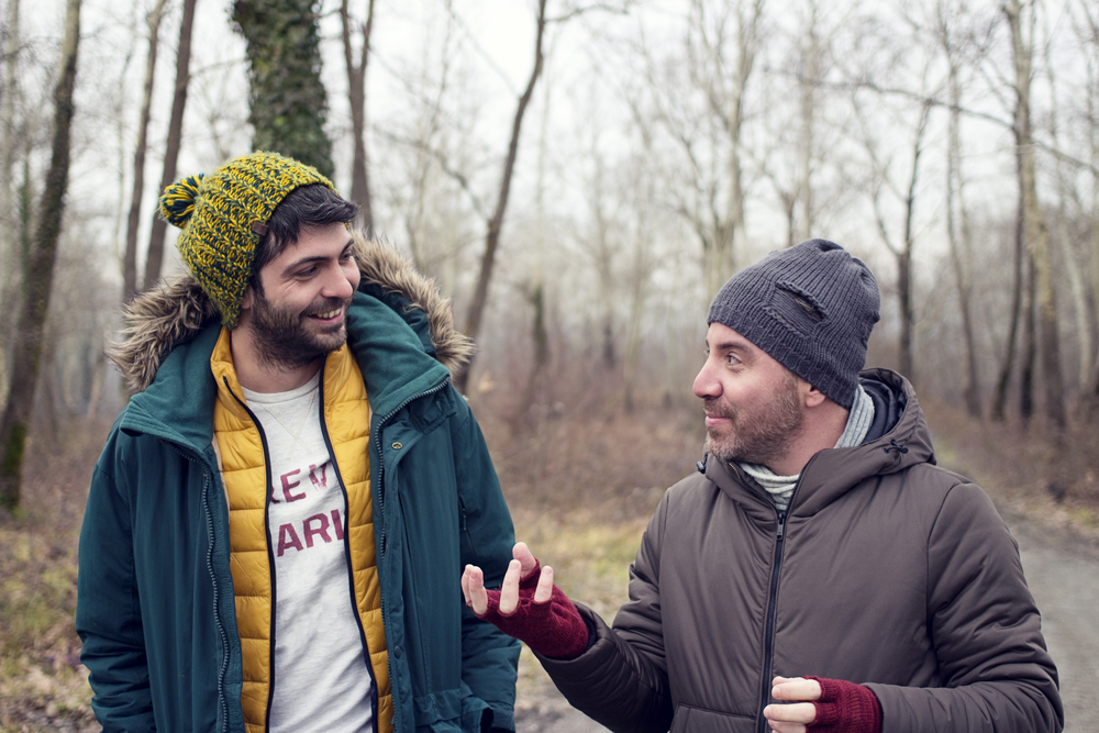 Two men engaging in conversation