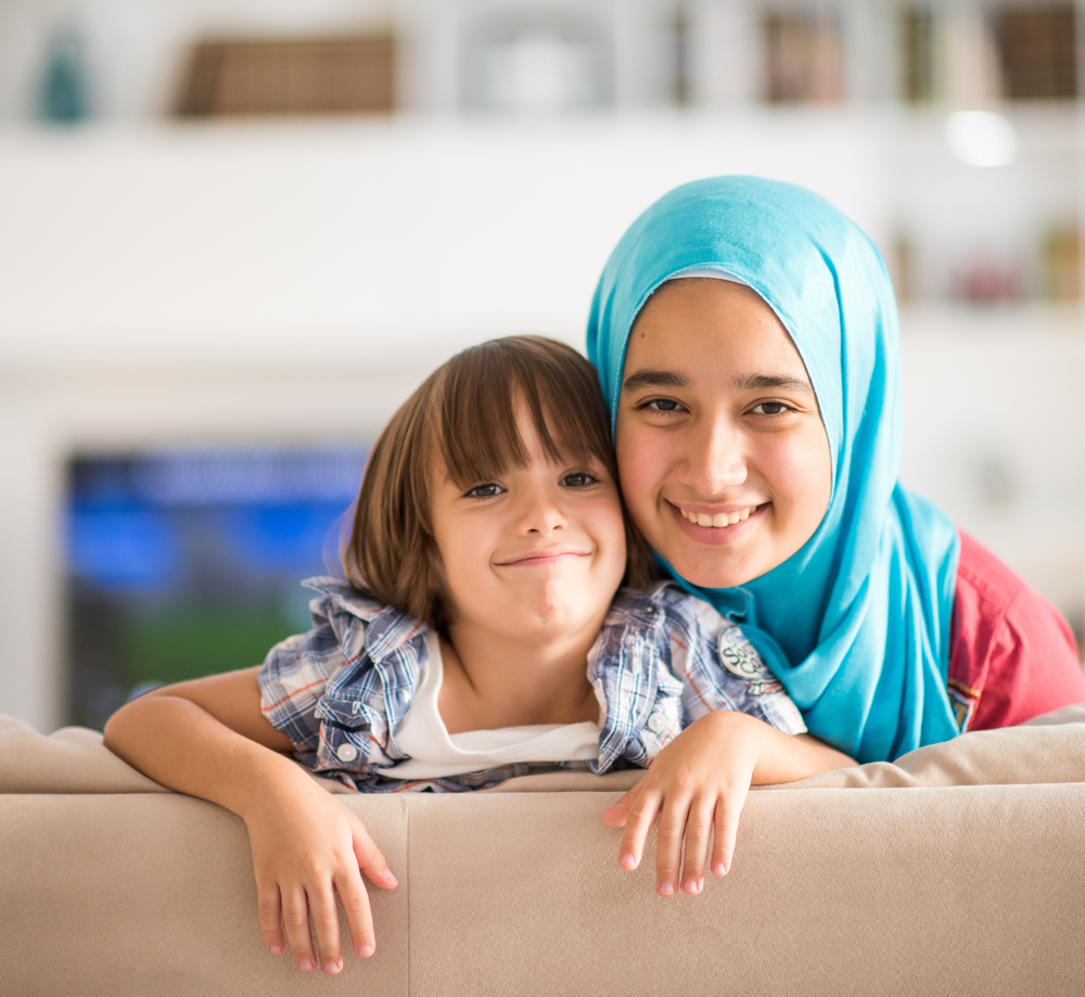 Two kids smiling to camera