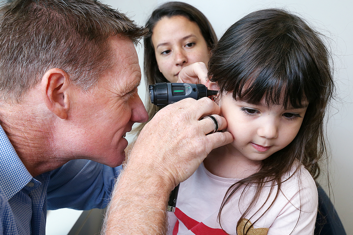 Dr Scott Parsons with a young patient