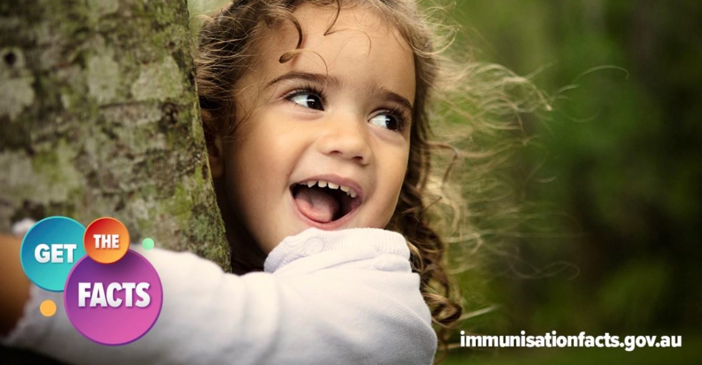 Young girl hugging a tree with 'Get the facts on immunisation' logo visible in the foreground.