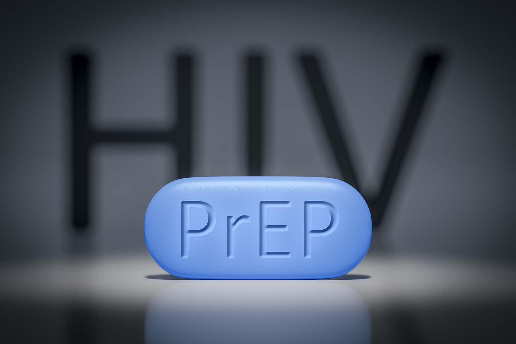 Artist's representation of a PrEP pill on a background displaying the letters: HIV