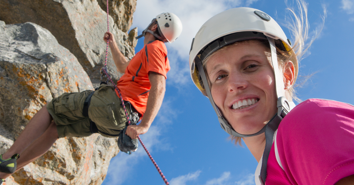 Two people having fun abseiling.