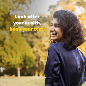 Image of a smiling woman with the text "Look after your health, book your test."