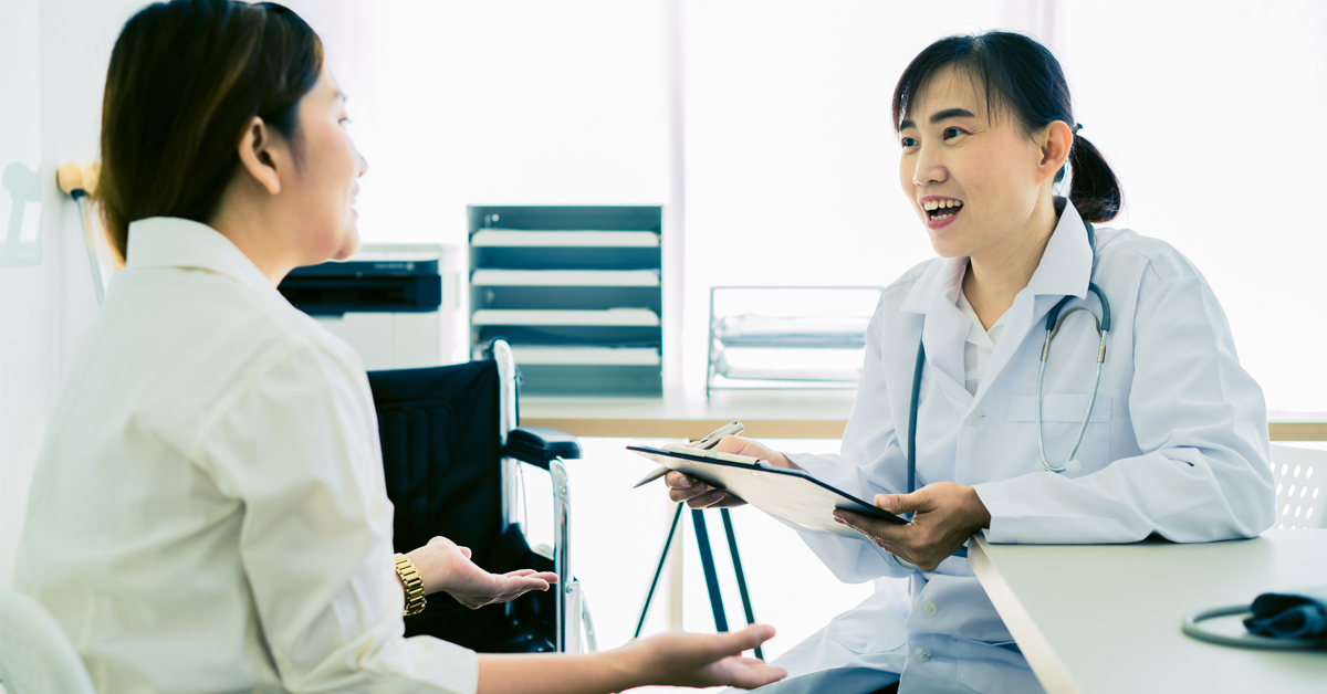 A woman talking to her GP about cervical screening.