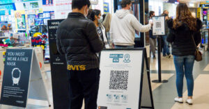 People checking in with QR codes in Victoria.