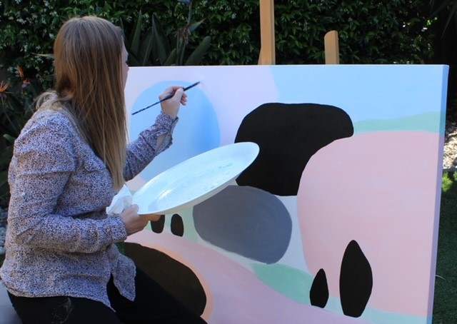 Melton artist Lisa Fitzpatrick working on her painting, Nature’s Beauty, as part of the NWMPHN Art Bomb mental health project.