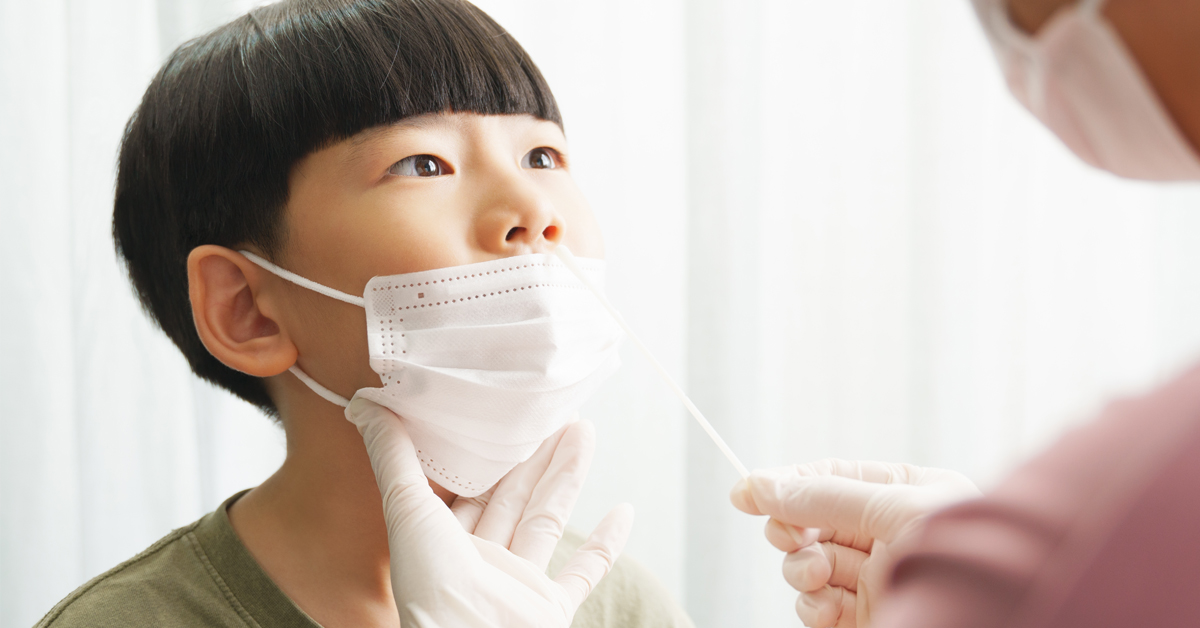 A young boy being tested for respiratory illness at a General Practice Respiratory Clinic.