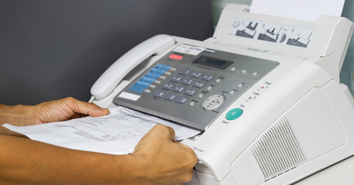 A person receiving a fax.