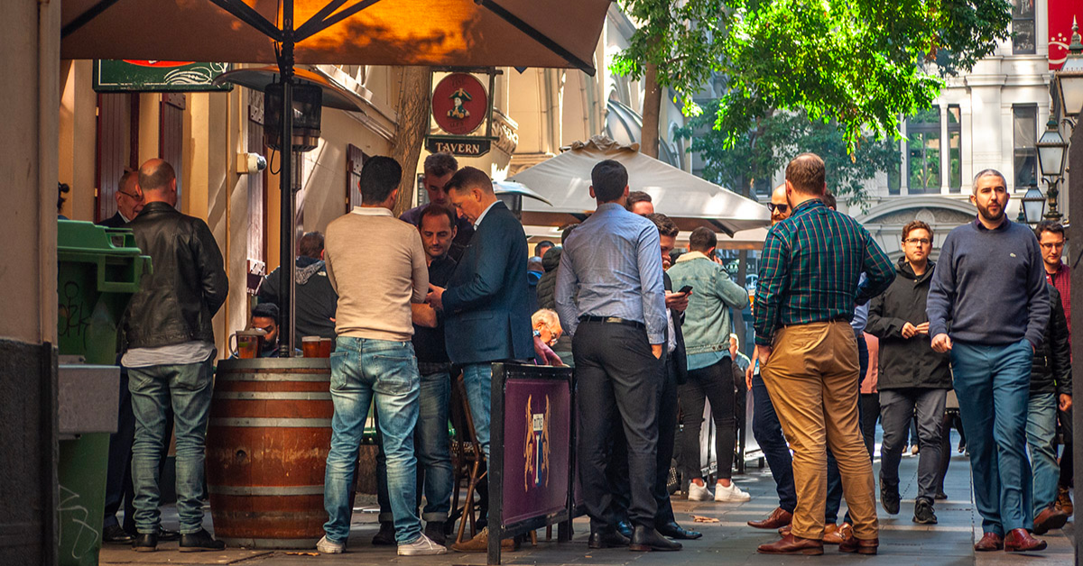 People gathering outside a pub in Melbourne.
