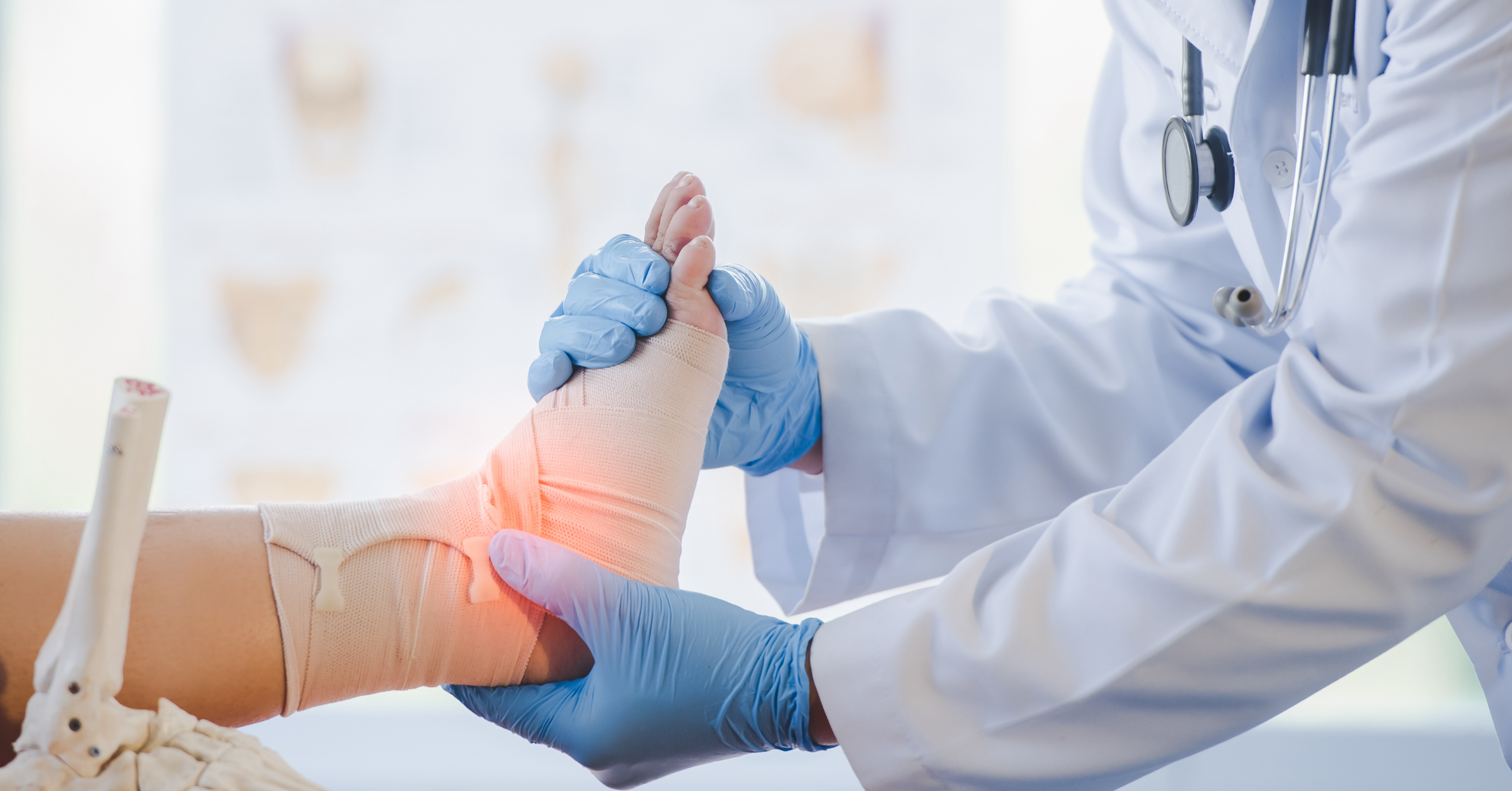 A GP checking a patient's badly sprained ankle.