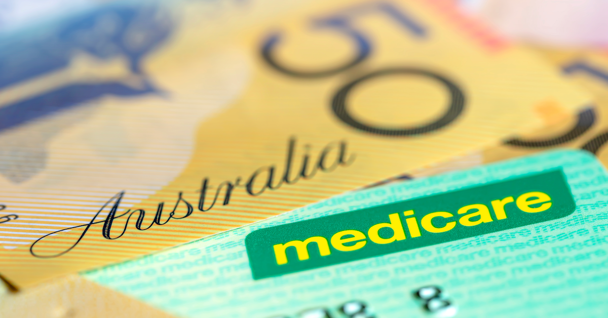 A $50 note sitting on top of a Medicare card.