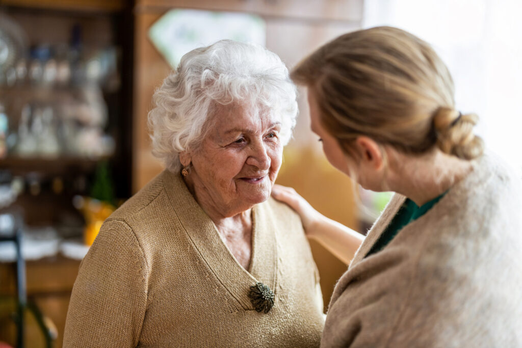 Image of elderly woman with dementia with carer