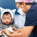 Doctor helping a child