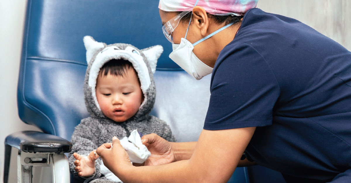 Doctor helping a child