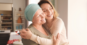 Cancer patient hugging a family member