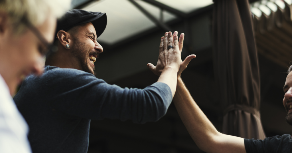 Two men high-fiving