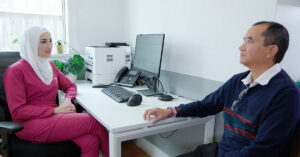 Utopia Refugee and Asylum Seeker Health GP Dr Amireh Fakhouri and Tuan Nguyen, a community member living hepatitis B.