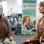 Chronic pain patient Amanda (left) does meditation exercises with Holstep Health senior pain physiotherapist Nicole Moore.