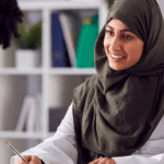 A practice manager speaking to a member of her team.