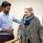Physiotherapist Ash Bhoina, Physiocare & Rehab Services, assists Marjorie Whitby, 93.