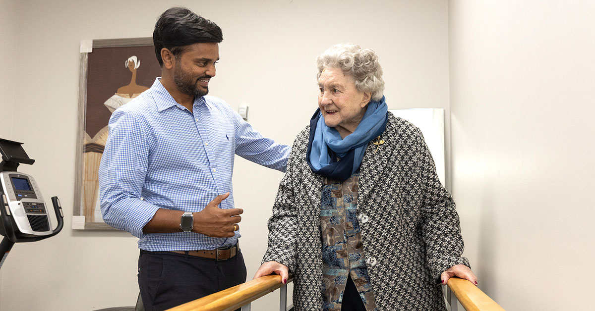 Physiotherapist Ash Bhoina, Physiocare & Rehab Services, assists Marjorie Whitby, 93.