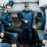 Volunteers for Street Side Medics - a free mobile medical service to people experiencing homelessness - share a joke together