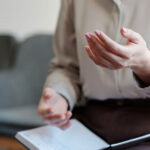 A female health professional takes notes and provides advice about endometriosis.